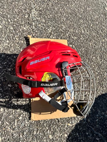 Used Large Bauer Re-Akt Helmet with cage