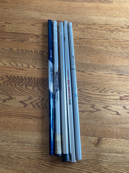 Five used lacrosse shafts