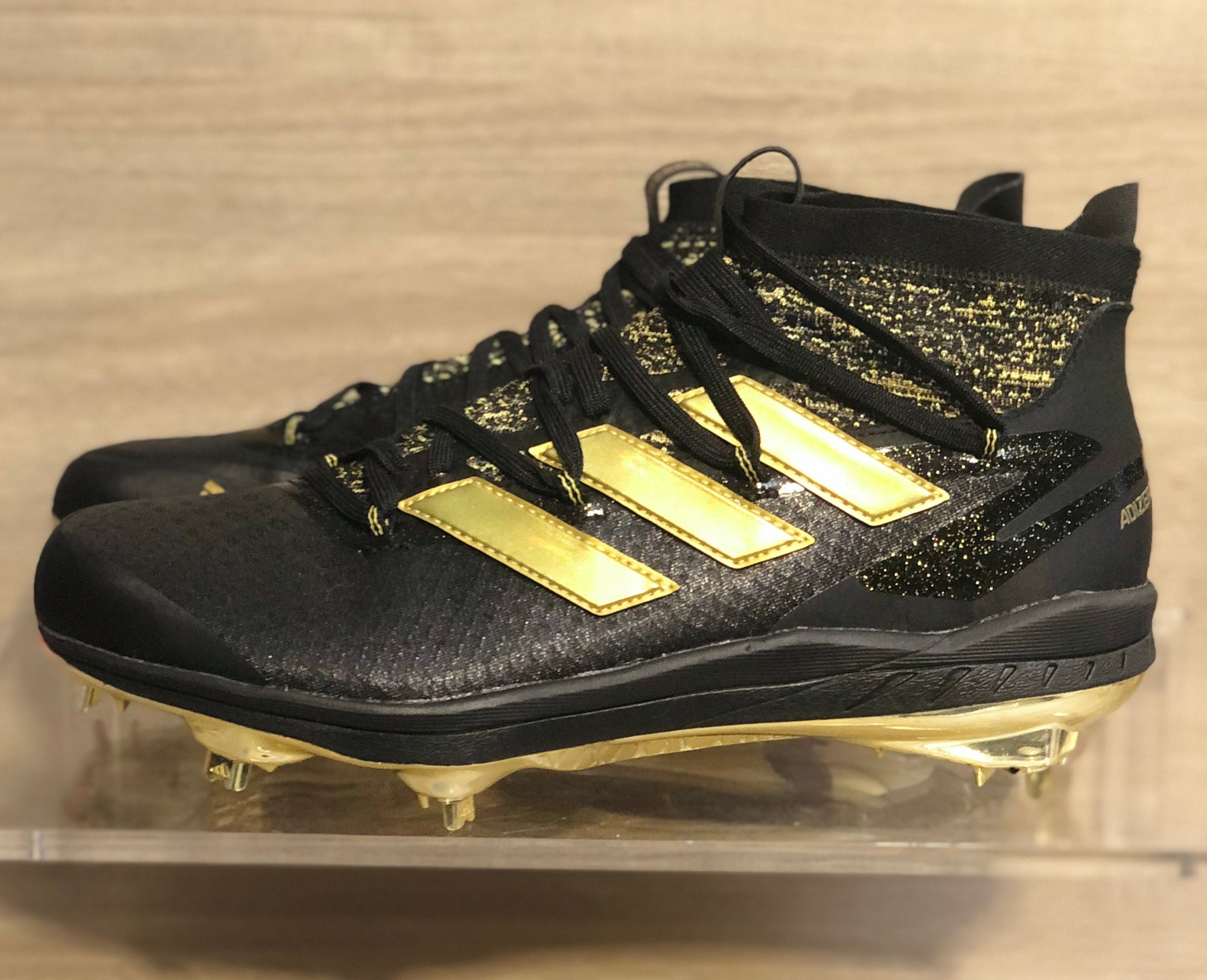 Adidas black and store gold baseball cleats