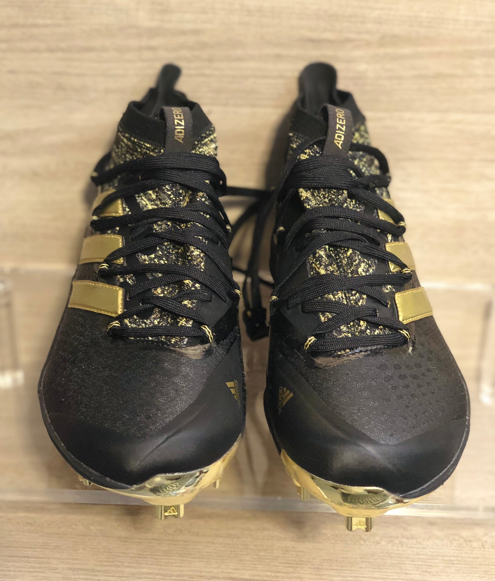 Gold and black baseball cleats on sale