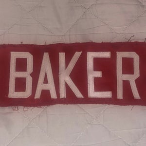 BAKER NAME PLATE RED WITH WHITE LETTERS