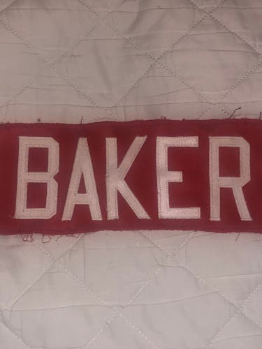 BAKER NAME PLATE RED WITH WHITE LETTERS