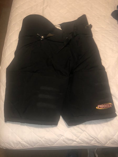 USED PROTEX BLACK LARGE HOCKEY PANTS