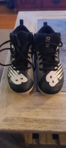 Black Youth Used Unisex Molded Cleats New Balance Mid Top Rush
