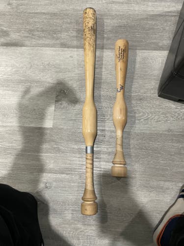 Used Camwood training bats. 31" and one hand trainer