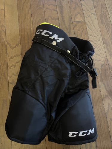 Junior Used Small CCM Hockey Pants and Reebok skate size 3