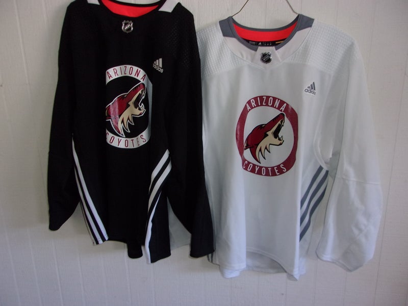 Bundle - 2 Arizona Coyotes worn Adidas practice jerseys (both size 58. 1 white and 1 black)