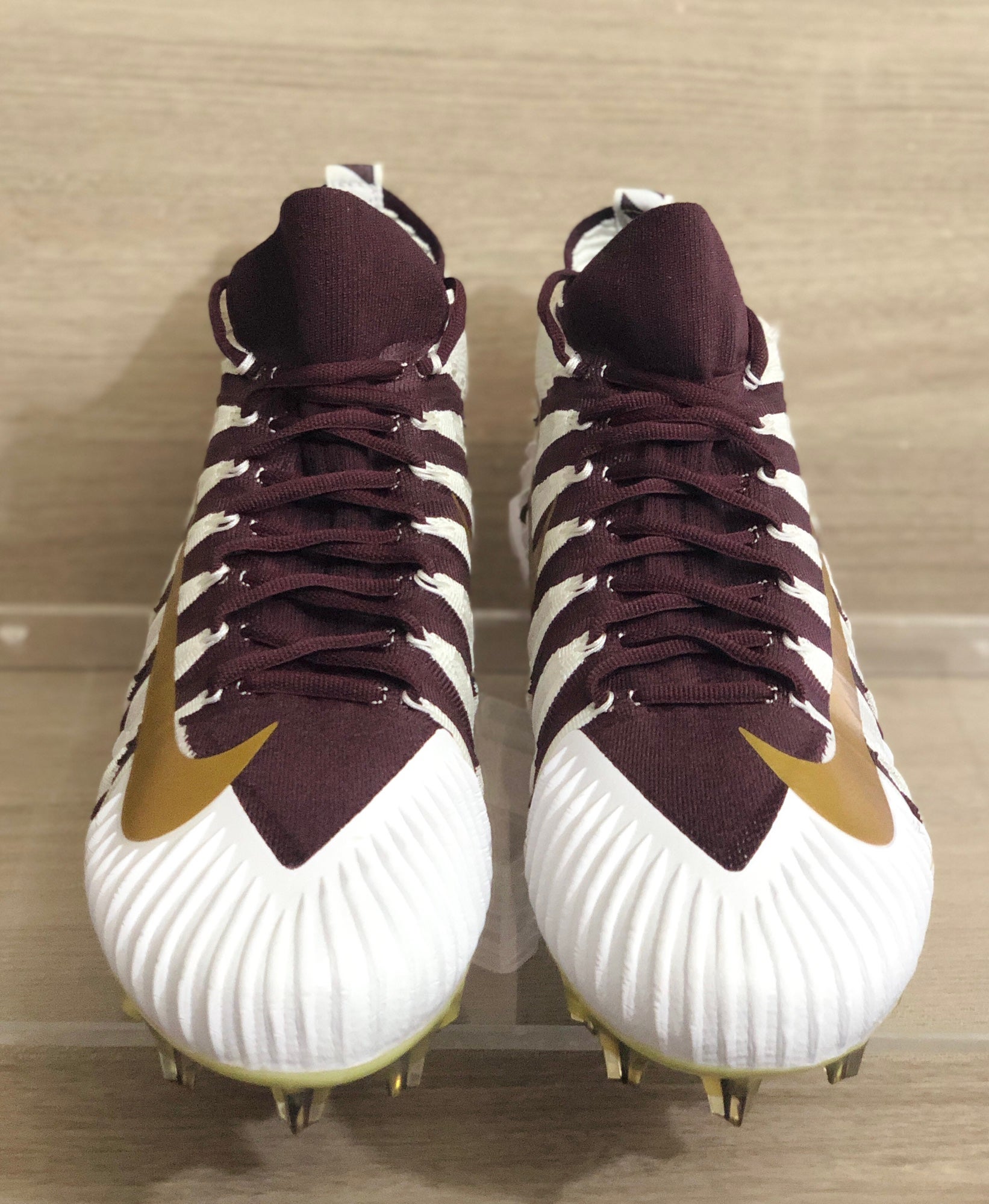 burgundy and gold football cleats