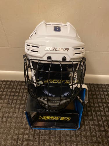 Lightly Used White Medium Bauer Re-Akt 200 Helmet