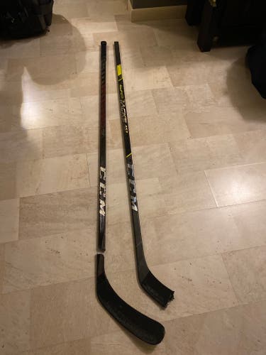 Two Broken Senior Hockey Sticks