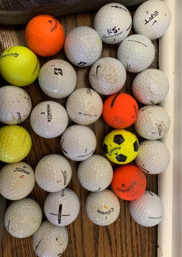 Assorted used golf balls