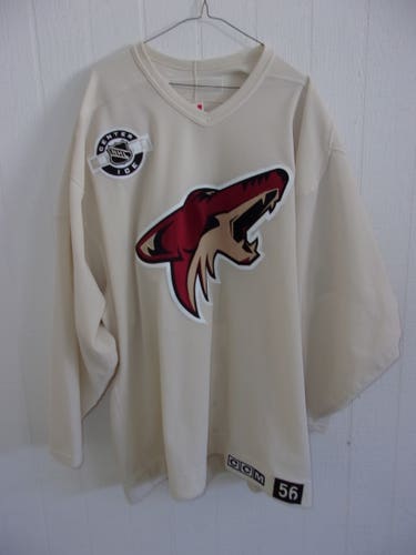 Phoenix Coyotes used tan (sand) CCM Center Ice practice jersey (size 56) from 2010-12