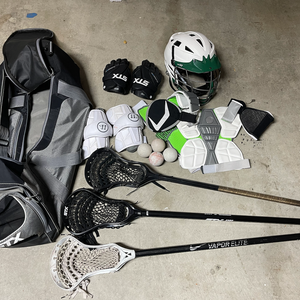 Used Lacrosse Gear.  3 sticks, large bag, chest pad, helmet, gloves, balls, etc.