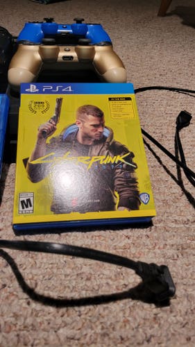 Used Sony Playstation 4 w/ cords, games