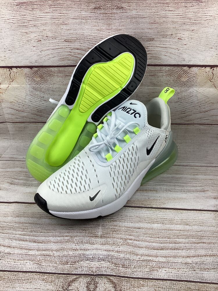 white and neon nike shoes