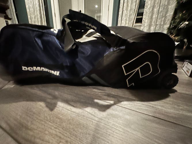 Blue Used DeMarini rolling bat bag