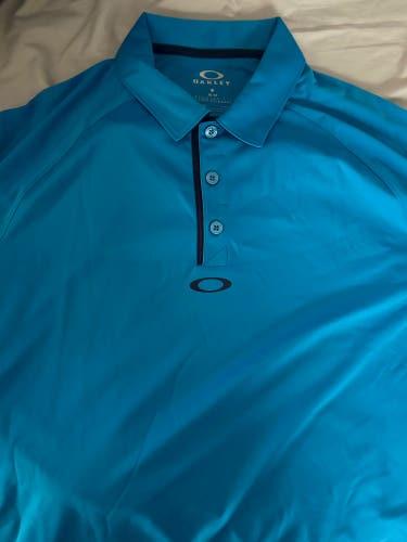 Top Golf Oakley Golf Shirt, Men’s Medium, Pacific Blue. Brand new with tags