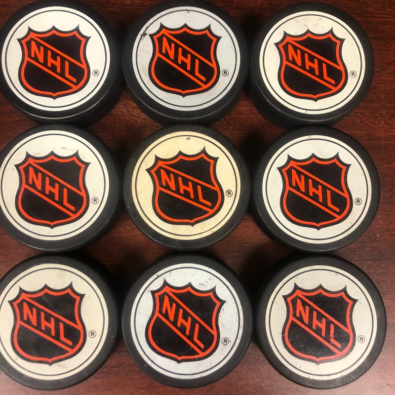 NHL logo pucks