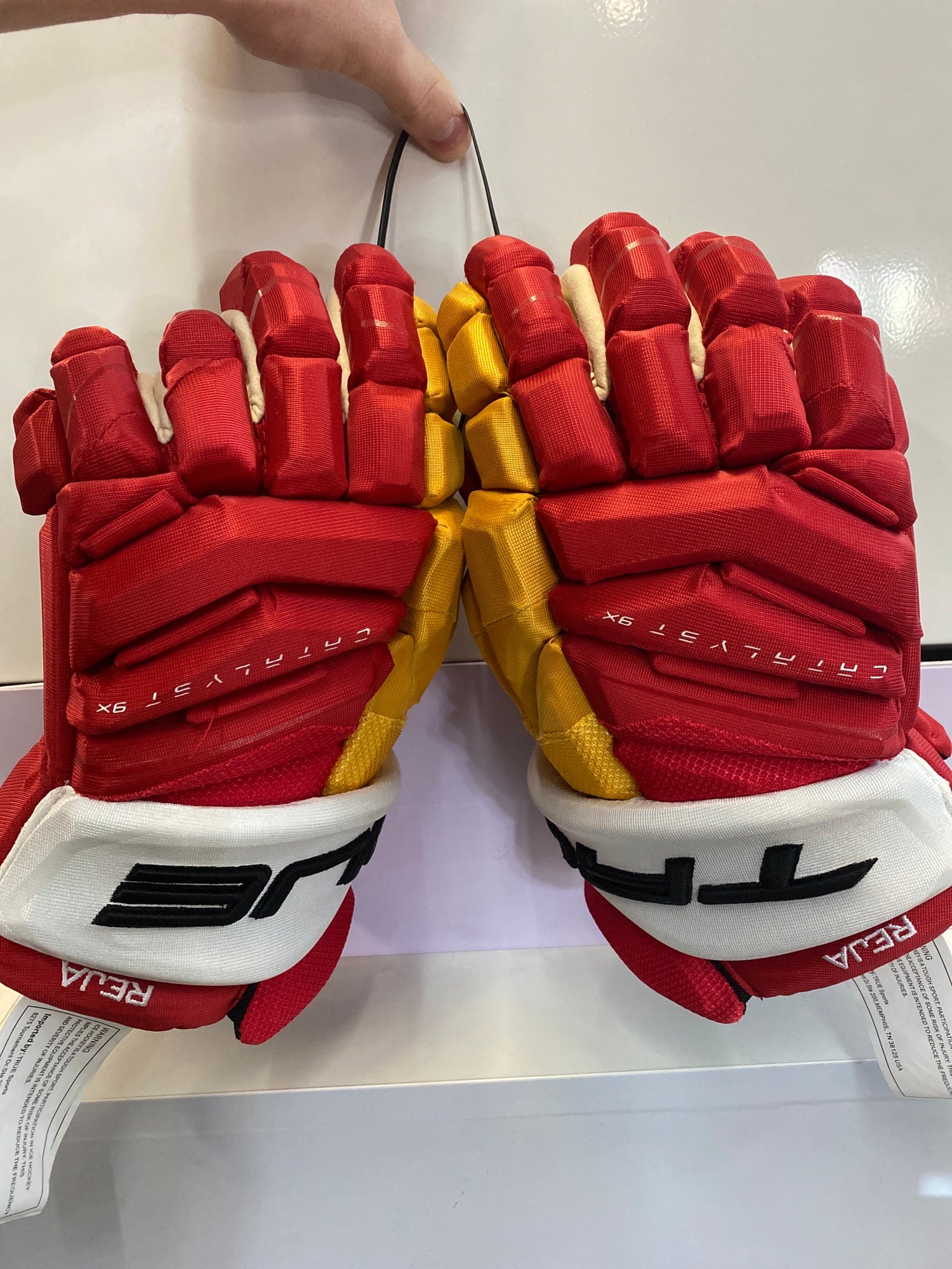 Red and yellow gloves from the Calgary Flames are live!