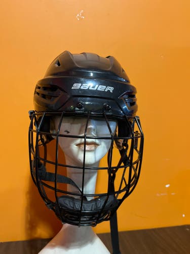 Used Black Bauer Re-AKT 95 Helmet & Cage Combo believed to be medium