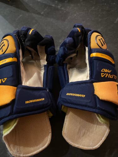 Used blue/gold Warrior 12" Alpha Lx Pro Gloves