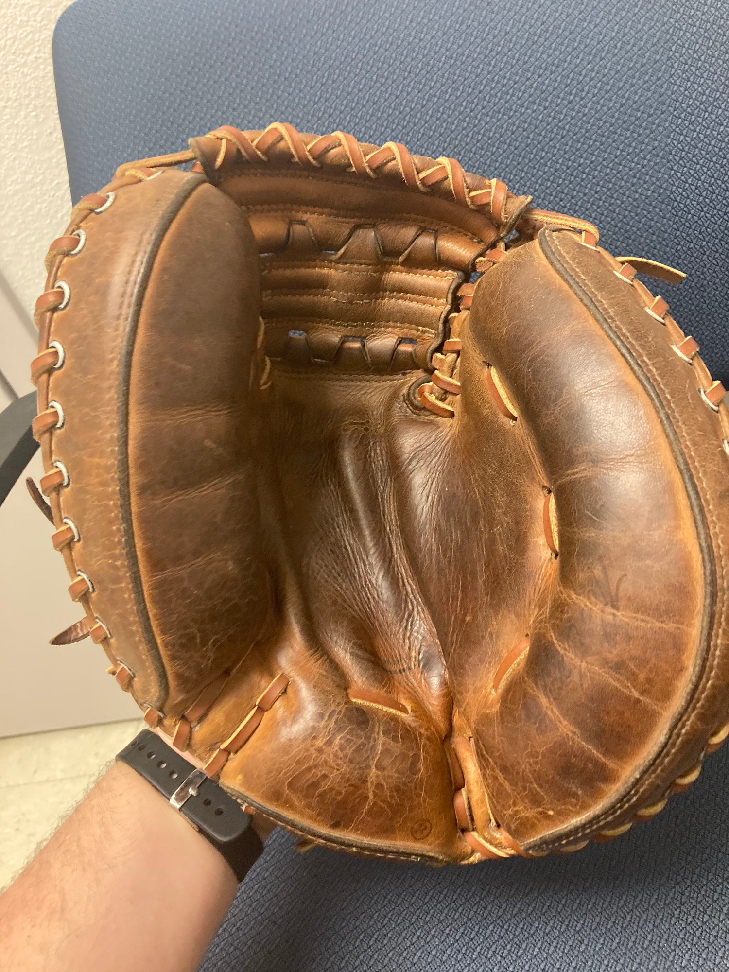 Old baseball glove and ball. An old baseball glove (1950 s Roy