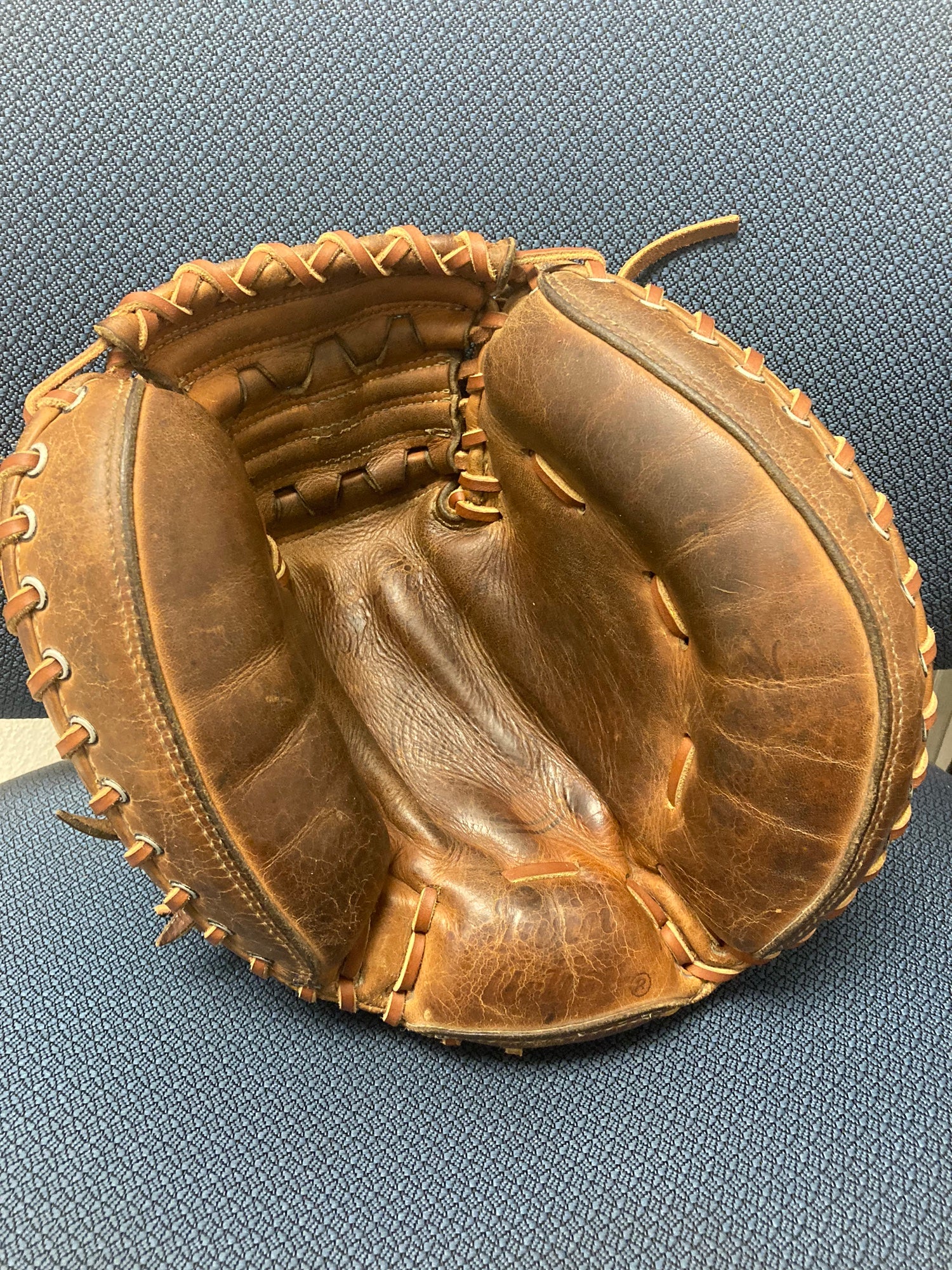 Old baseball glove and ball. An old baseball glove (1950 s Roy