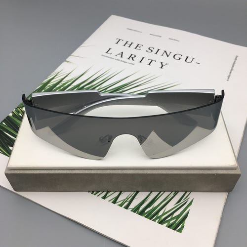 Trendy Rimless Futuristic Wrap Around Sunglasses Cyberpunk Visor Sunglasses