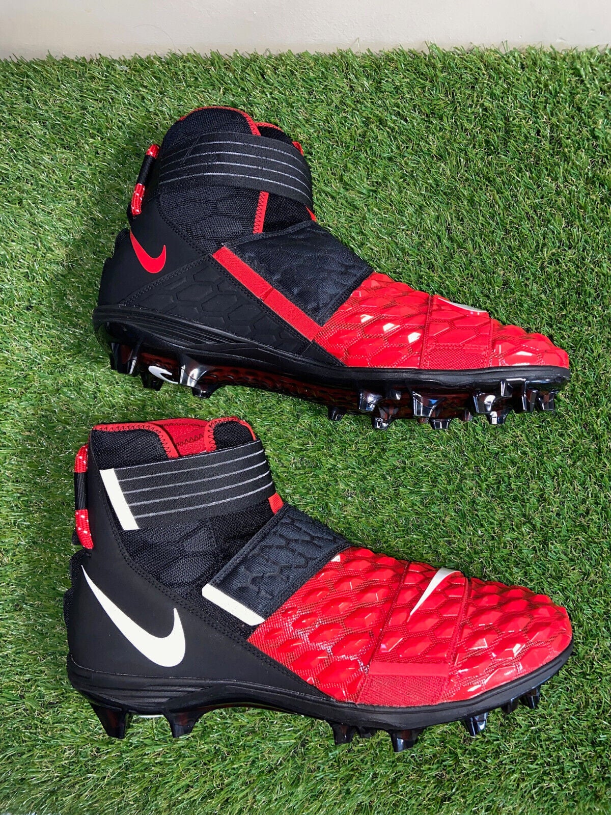 red and black football cleats
