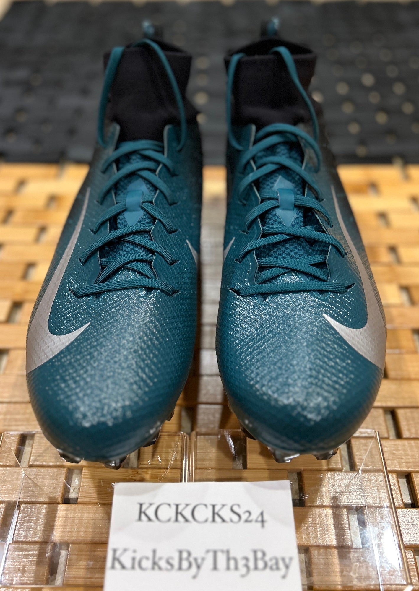 black and teal football cleats