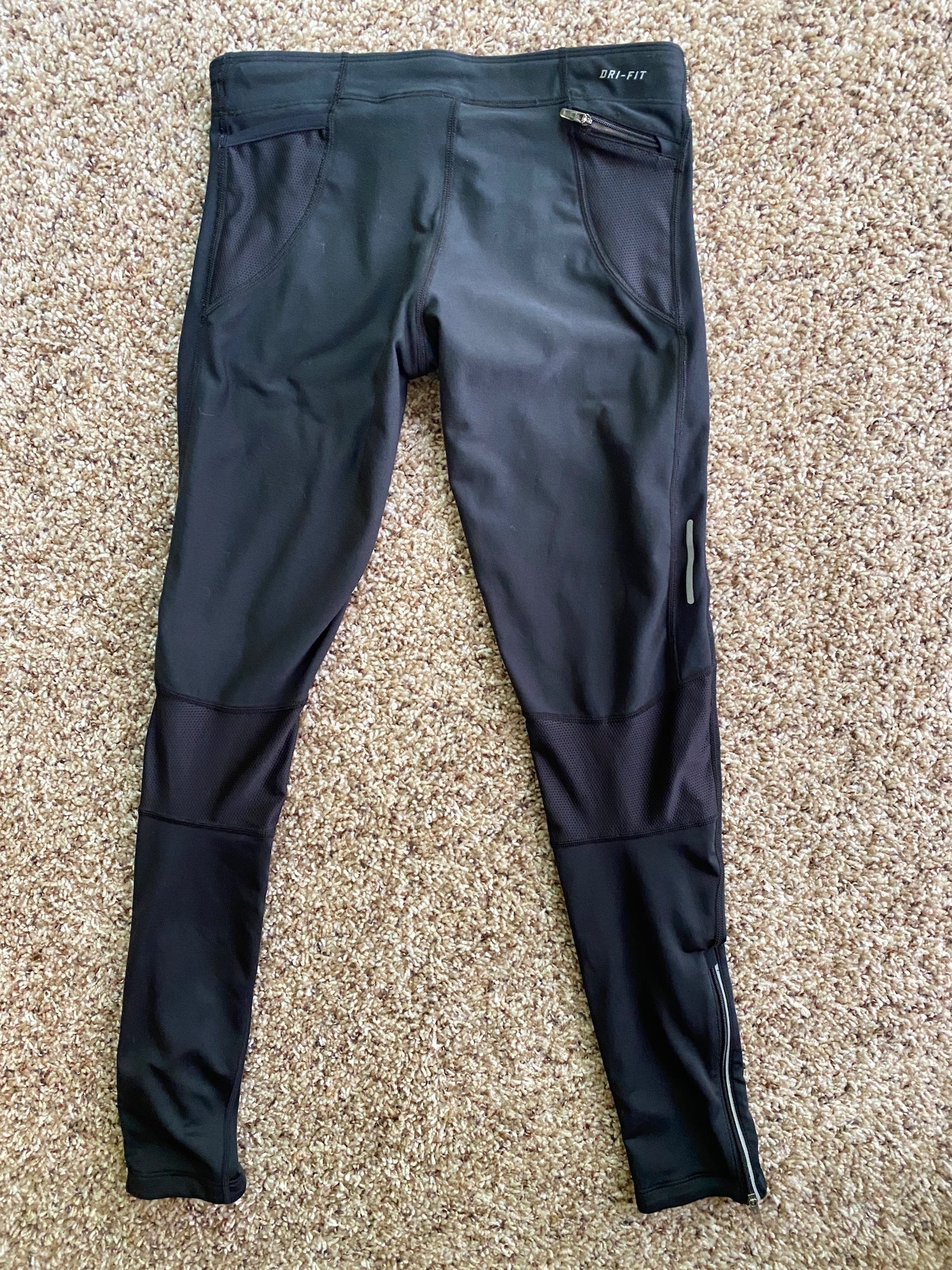 nike track pants with zip pockets