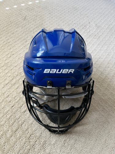 Used Medium Bauer Re-Akt Helmet with Under Armour Face mask And Chinstrap