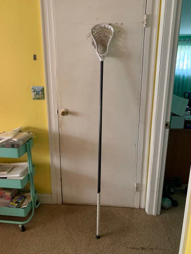 Complete defense lacrosse stick with Maverik Tank 2.0 head and strinking shaft