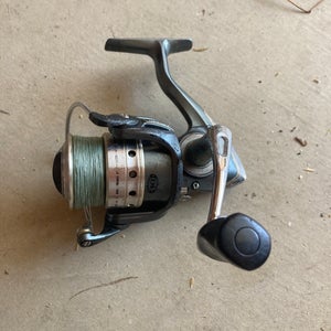 Pflueger president size 30 with 30lb braid in good shape