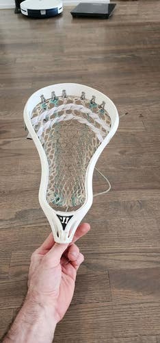 Warrior Evolution 3X lacrosse head with STX memory mesh