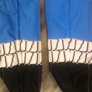 GAME WORN SIZE LARGE BLUE/WHITE SAGINAW SPIRIT MARIO BROTHERS  HOCKEY SOCKS