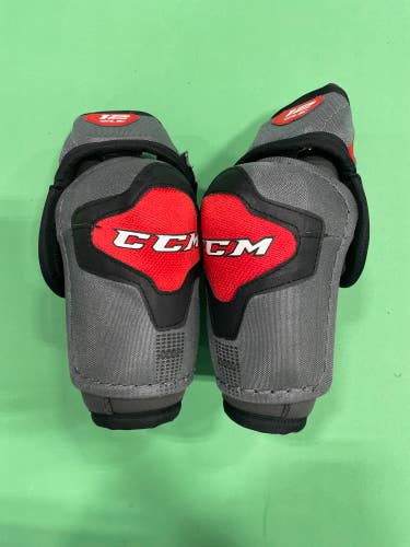 Used Junior CCM U+12 LE Hockey Elbow Pads (Size: Large)