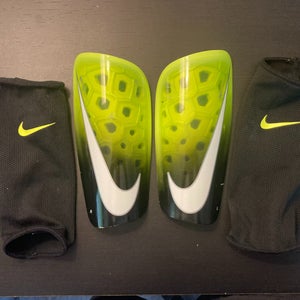 Used Unisex Medium Nike Mercurial lite Shin Guards; Black and Green