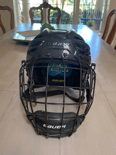 Used Large Bauer Re-Akt 150 Helmet with Large Bauer cage