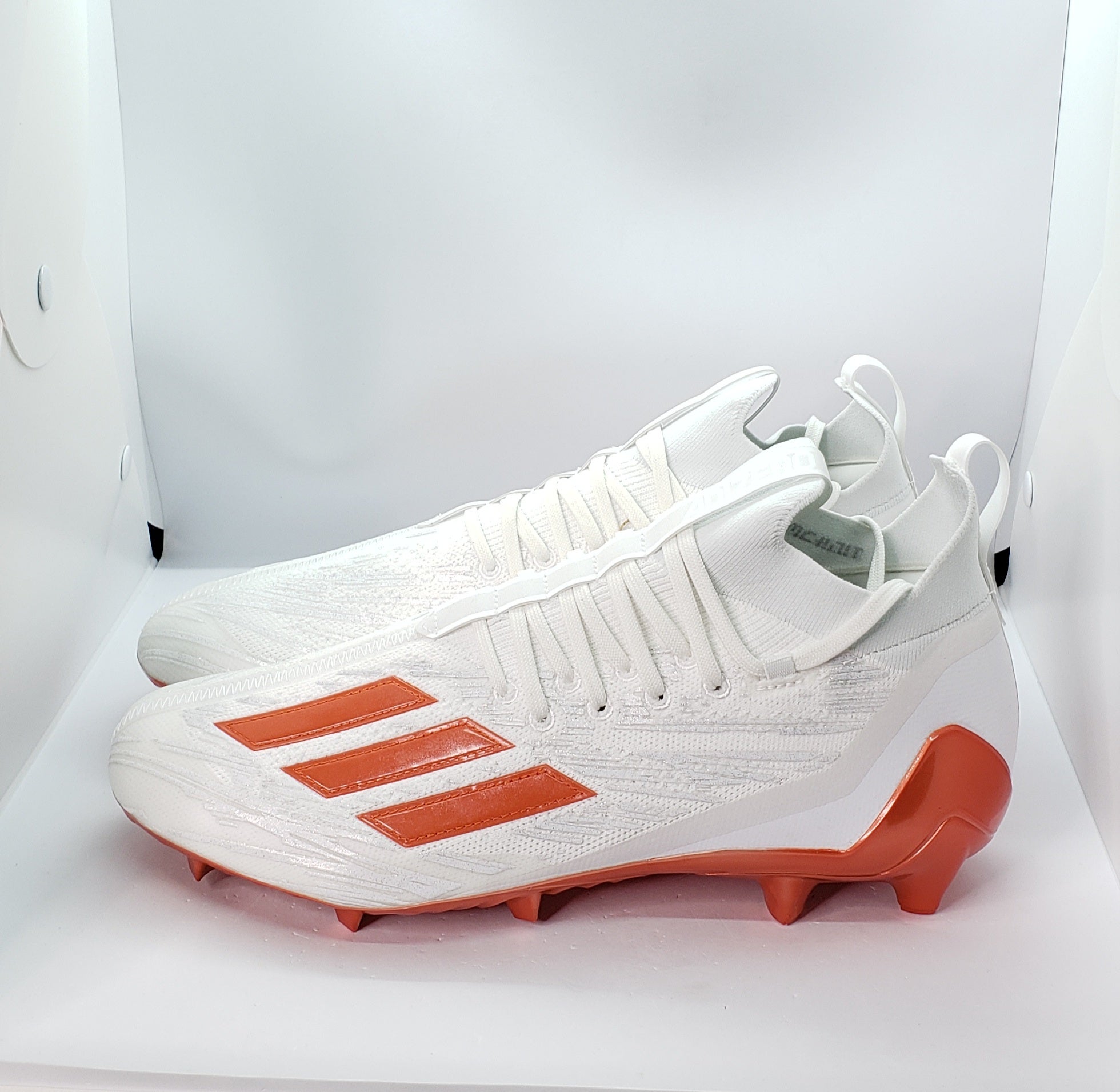 Orange and white 2025 adidas football cleats