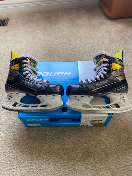 Junior Used Bauer Supreme S37 Hockey Skates Regular Width Size 4.5 with used extra set of blades