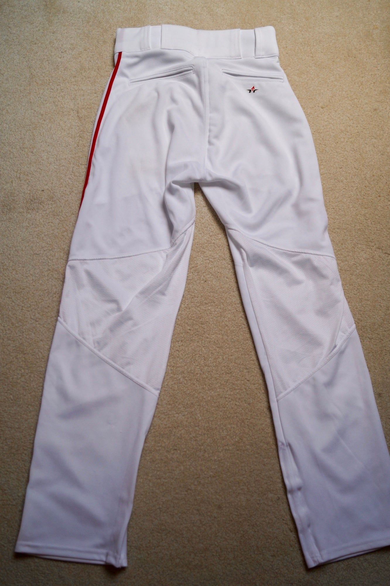 nike white baseball pants with red stripe