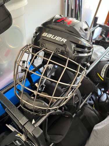Used Medium Bauer  Re-Akt Helmet w/ Re-Akt Cage