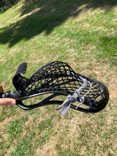 Used Black ECD lacrosse head (New mesh and strings)