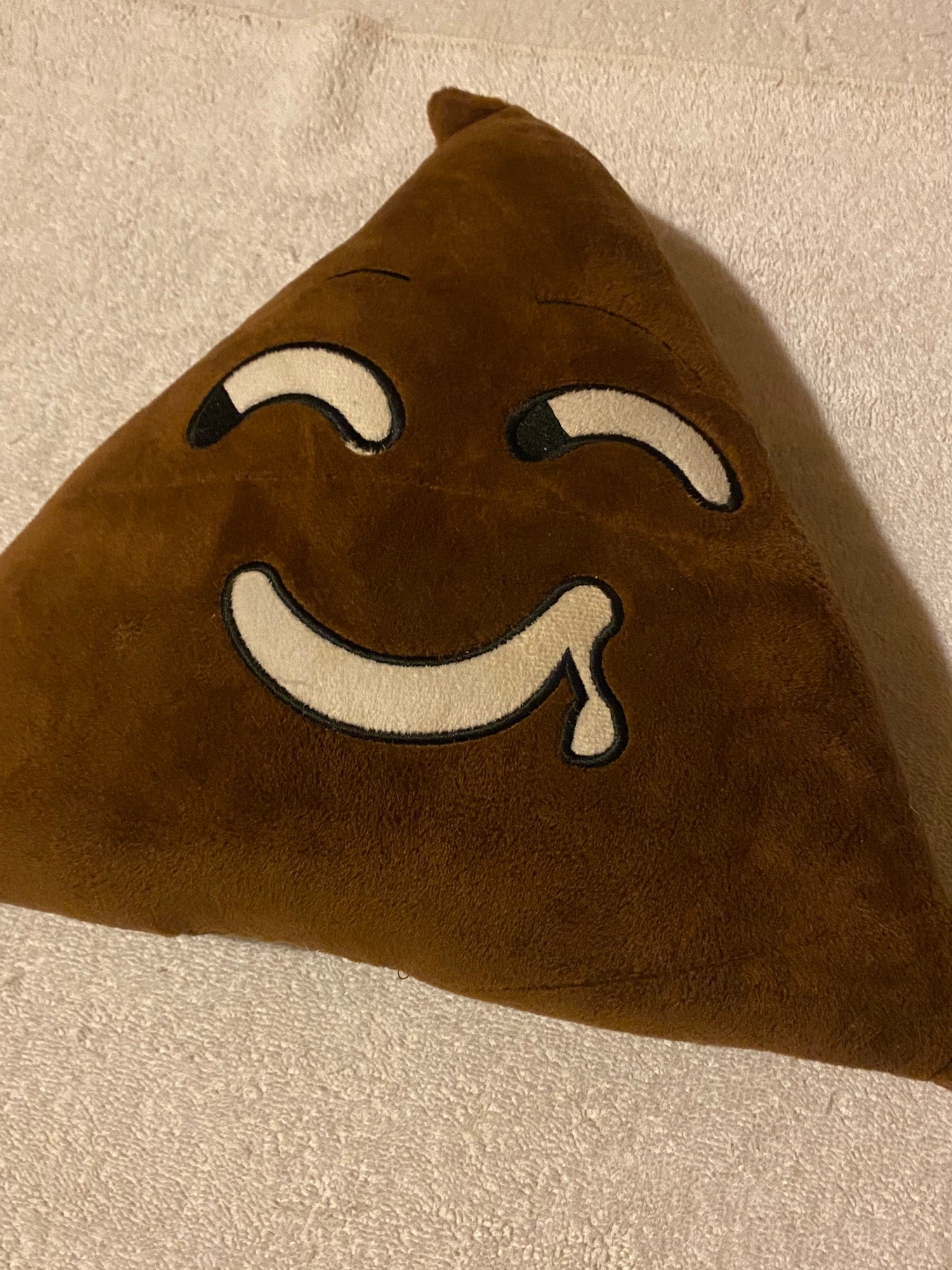 poop emoji pillow
