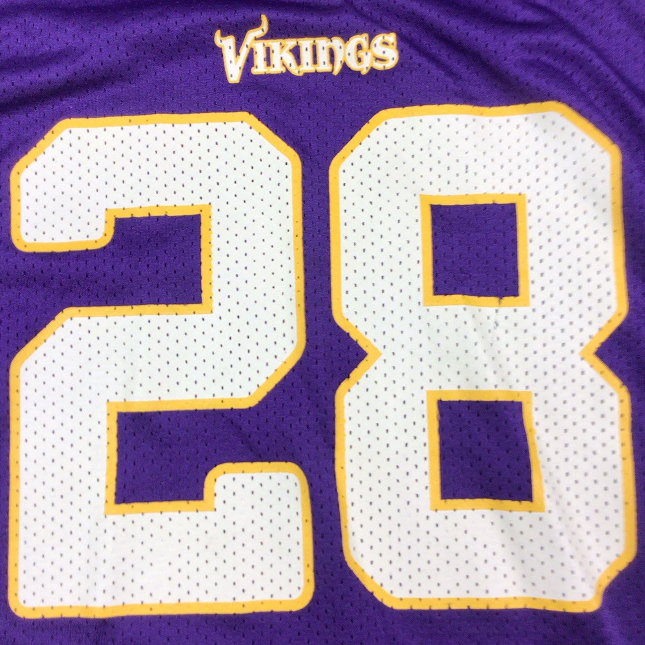 Y2K Minnesota Vikings Adrian Peterson NFL jersey. #28. Tagged as a youth XL