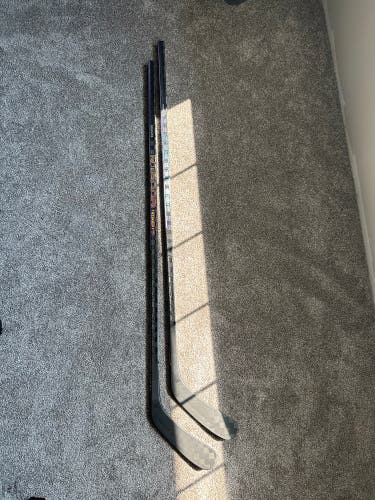 2 Sticks NEW “CCM”Ribcor Trigger 7 LH 75 Flex P29 Dressed Pro Blackout sticks.