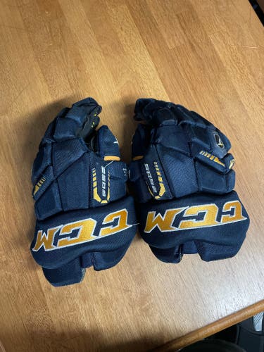 used CCM 13" gloves dark blue