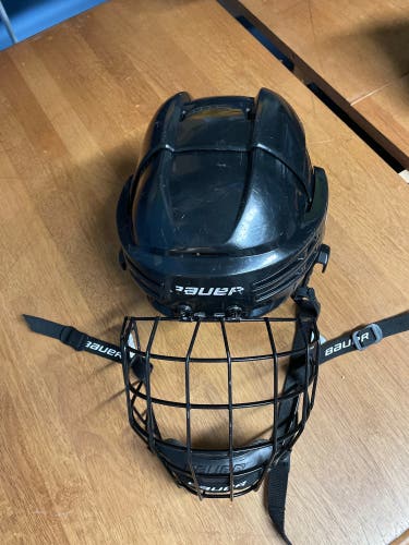 Used black Small Bauer helmet with black cage