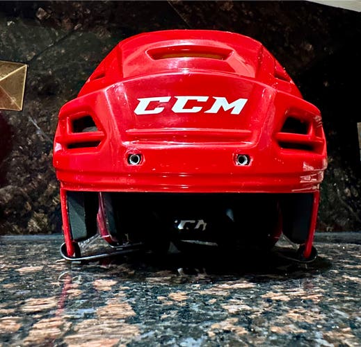 Used red medium CCM Tacks 310 hockey helmet